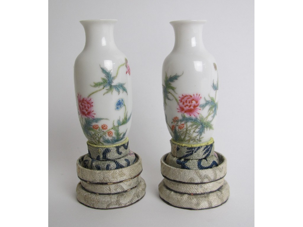 Appraisal: A pair of Chinese eggshell miniature baluster vases painted with