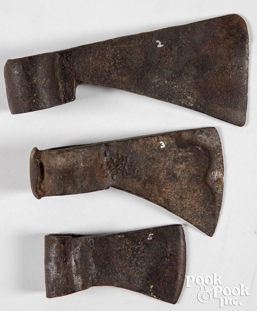 Appraisal: Three iron trade axe heads Three iron trade axe heads