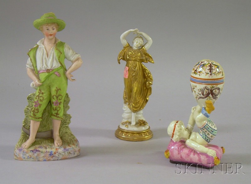 Appraisal: Three European Ceramic Figures a continental painted bisque figure of