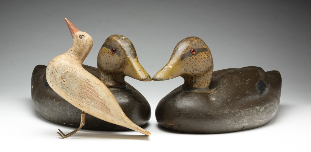 Appraisal: THREE AMERICAN CARVED BIRDS Twentieth century Two female mallards signed