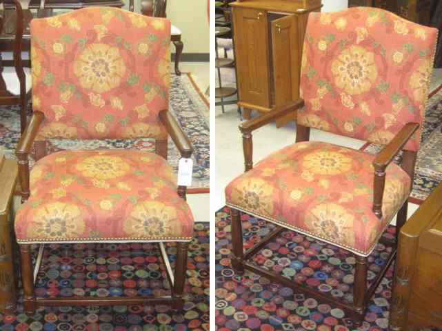 Appraisal: PAIR OF ANTIQUE REPRODUCTION ARMCHAIRS with oak frames and matching