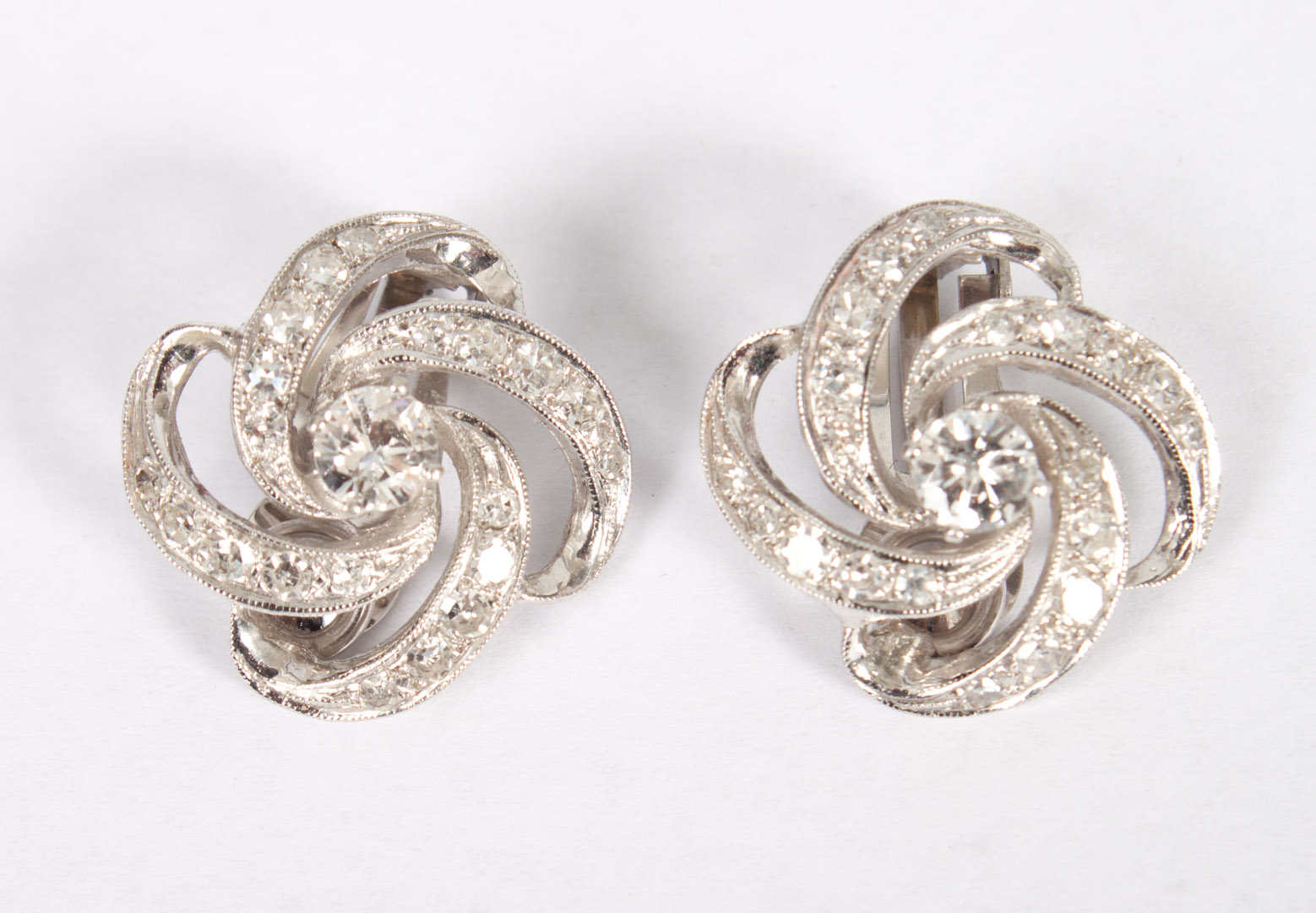 Appraisal: Lady's K white gold diamond earrings pinwheel shape clip backs