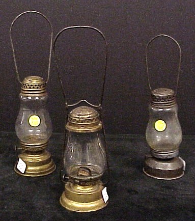 Appraisal: Three skating lamps one Dietz brass one other brass and