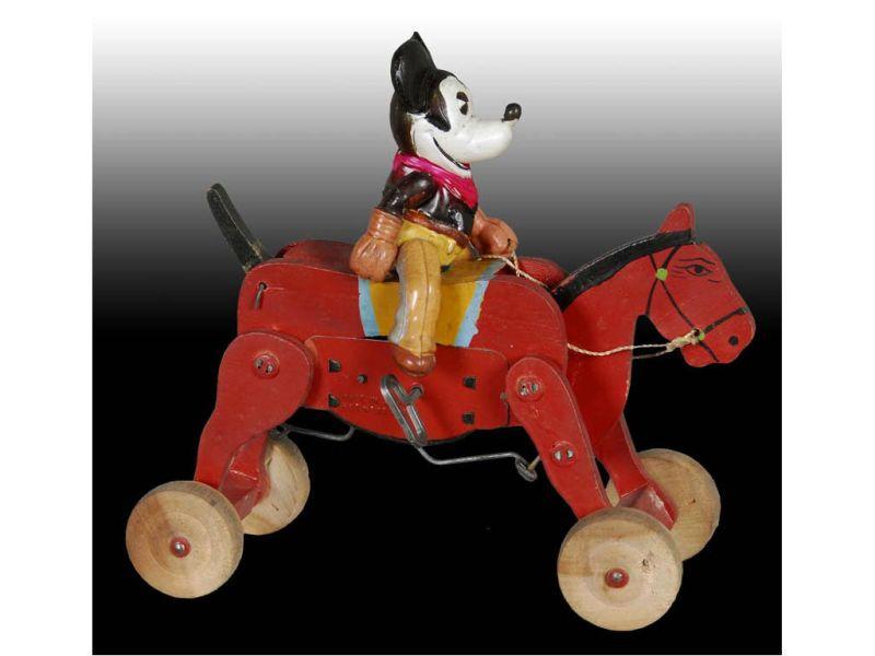 Appraisal: Walt Disney Celluloid Cowboy Mickey Mouse on Bucki Description Horse