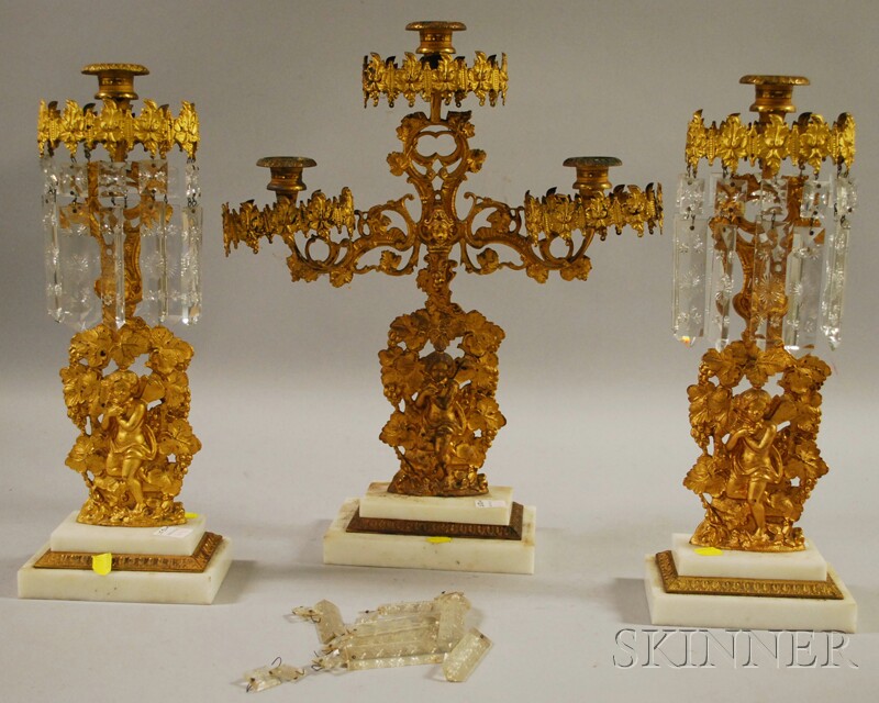 Appraisal: Three-piece Gilt-metal Figural and Marble Base Girandole Set with Prisms