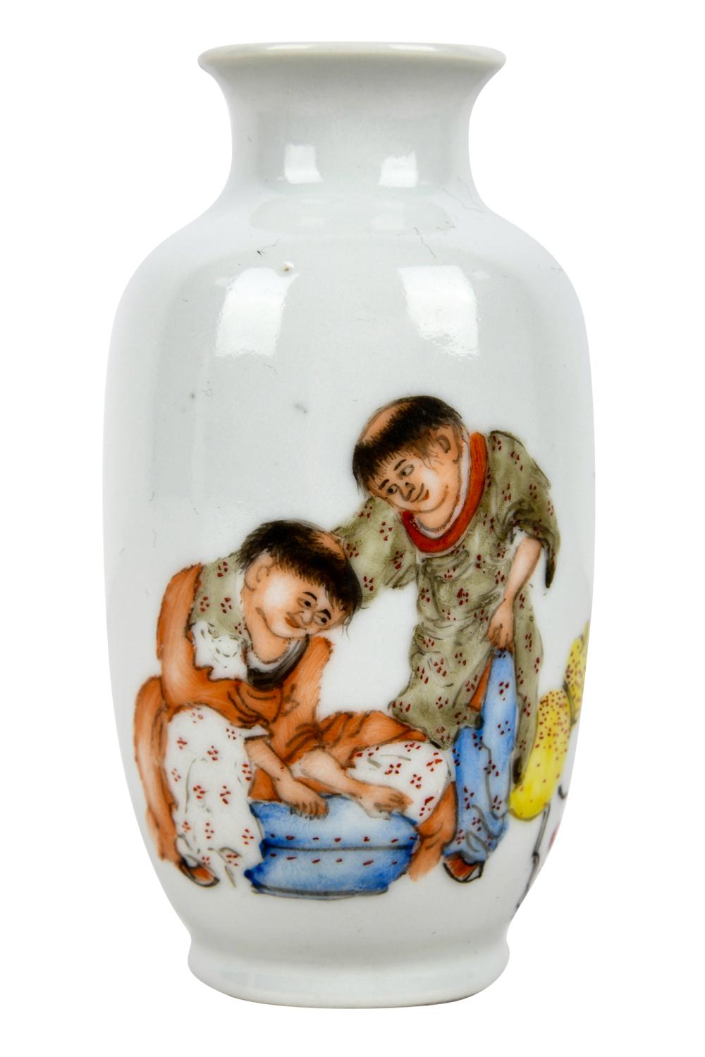 Appraisal: CHINESE PORCELAIN VASEmarked to underside depicting two figures inches high