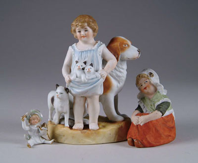 Appraisal: GROUP OF THREE FIGURINES - t young girl with dog