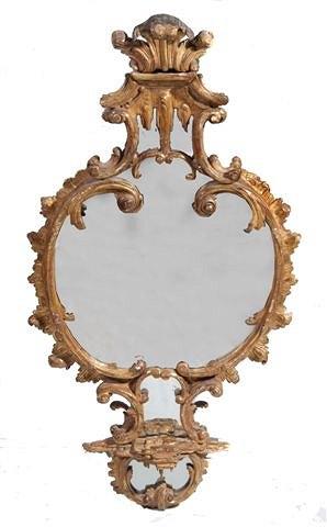 Appraisal: AN TH CENTURY CARVED GILTWOOD LOOKING GLASS with acanthus leaf