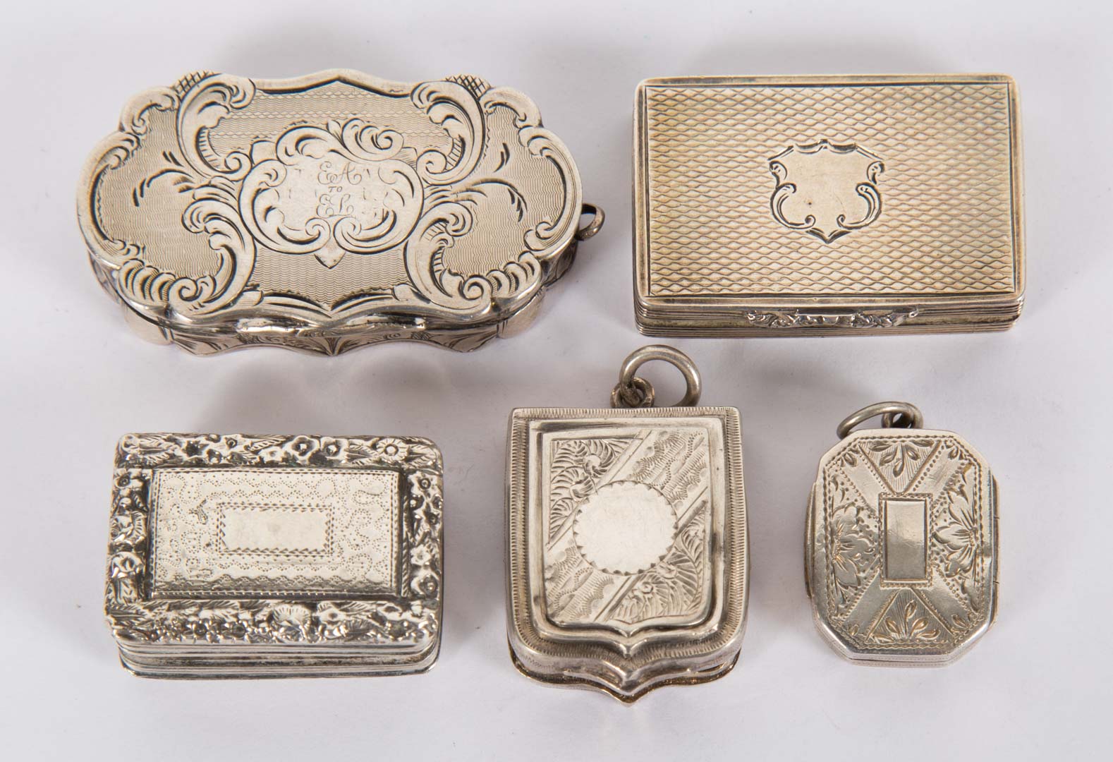 Appraisal: Five English sterling silver vinaigrettes