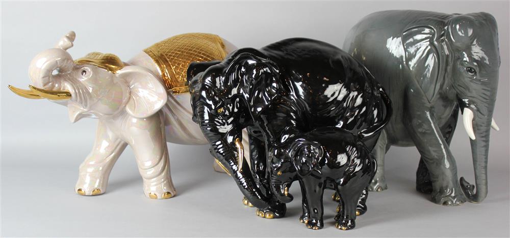 Appraisal: THREE ELEPHANT GROUPS including a black glazed group of a