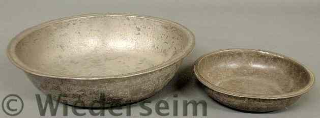 Appraisal: Two pewter basins th c largest h x diam