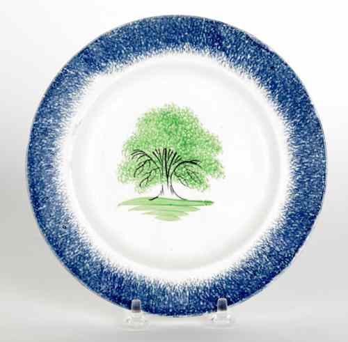 Appraisal: Blue spatter plate with a tree th c dia Provenance