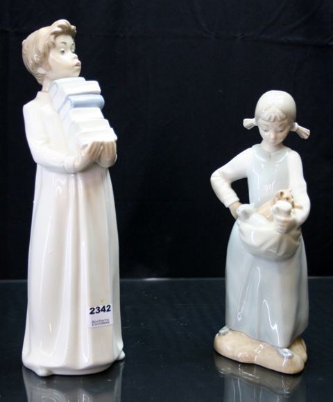 Appraisal: A Lladro Nao figure of a boy with books cm