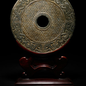 Appraisal: A Chinese Liangzhu-style Carved Nephrite Jade Bi Disc LATE TH