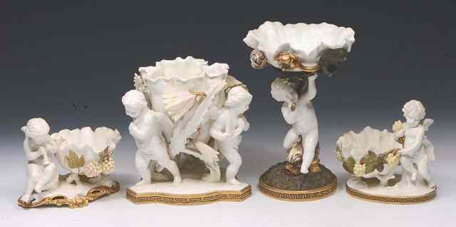 Appraisal: A MOORE BROTHERS WHITE GLAZED CENTRE PIECE in the form