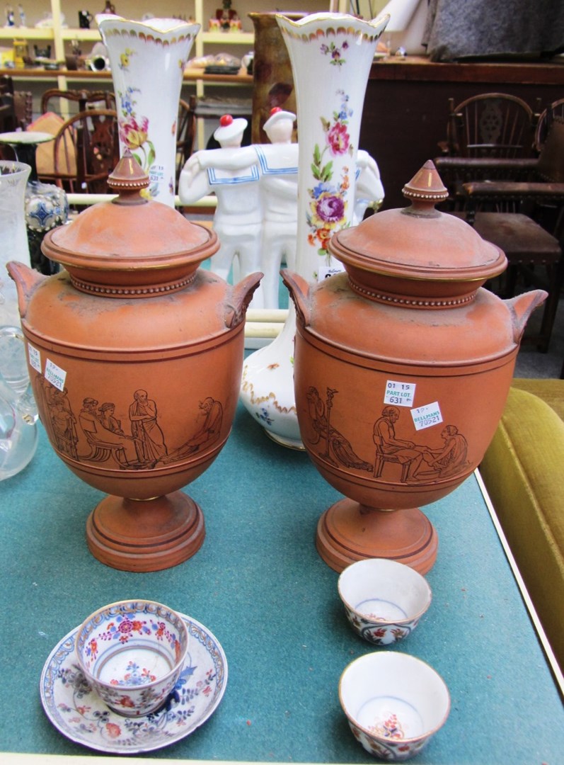 Appraisal: A pair of Torquay terracotta urns and covers after Flaxman