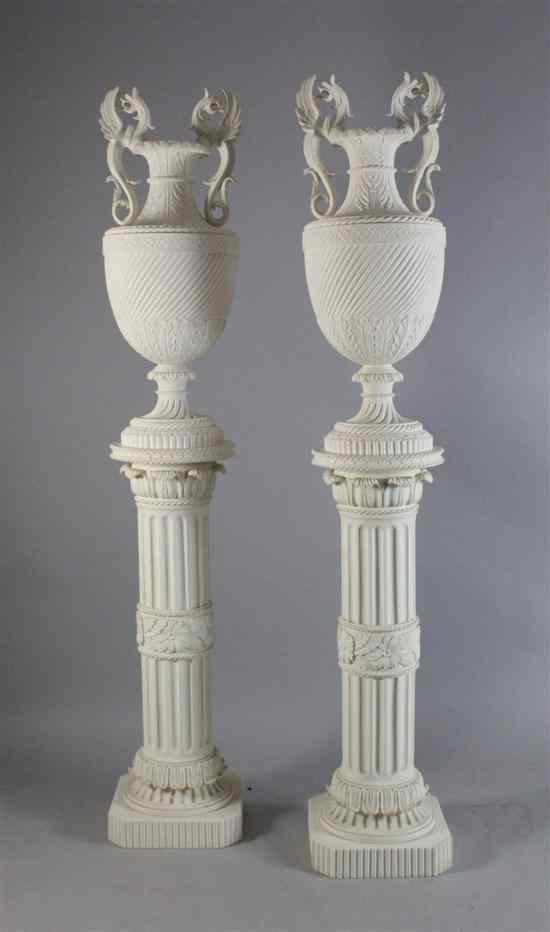 Appraisal: A modern pair of composition urns on pedestals ins Estimate