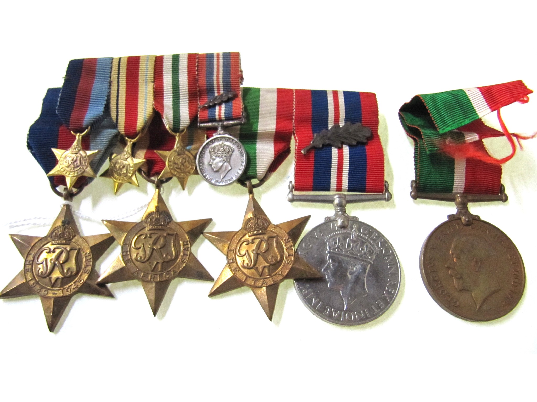 Appraisal: A lot comprising a WWII group of four with oak