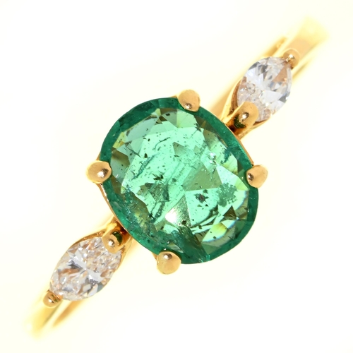 Appraisal: An emerald and diamond ring the larger oval emerald flanked