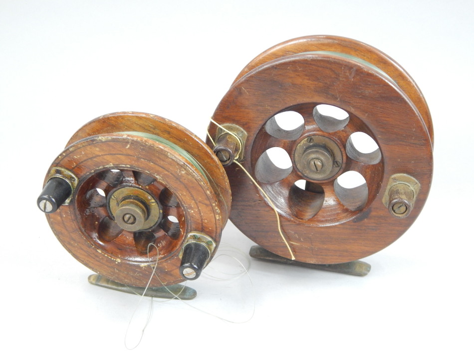 Appraisal: Two mahogany and brass fishing reels the largest cm diameter