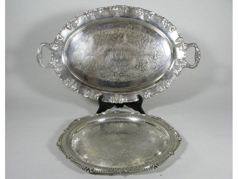 Appraisal: Two Silverplate Serving Trays the first of circular form with