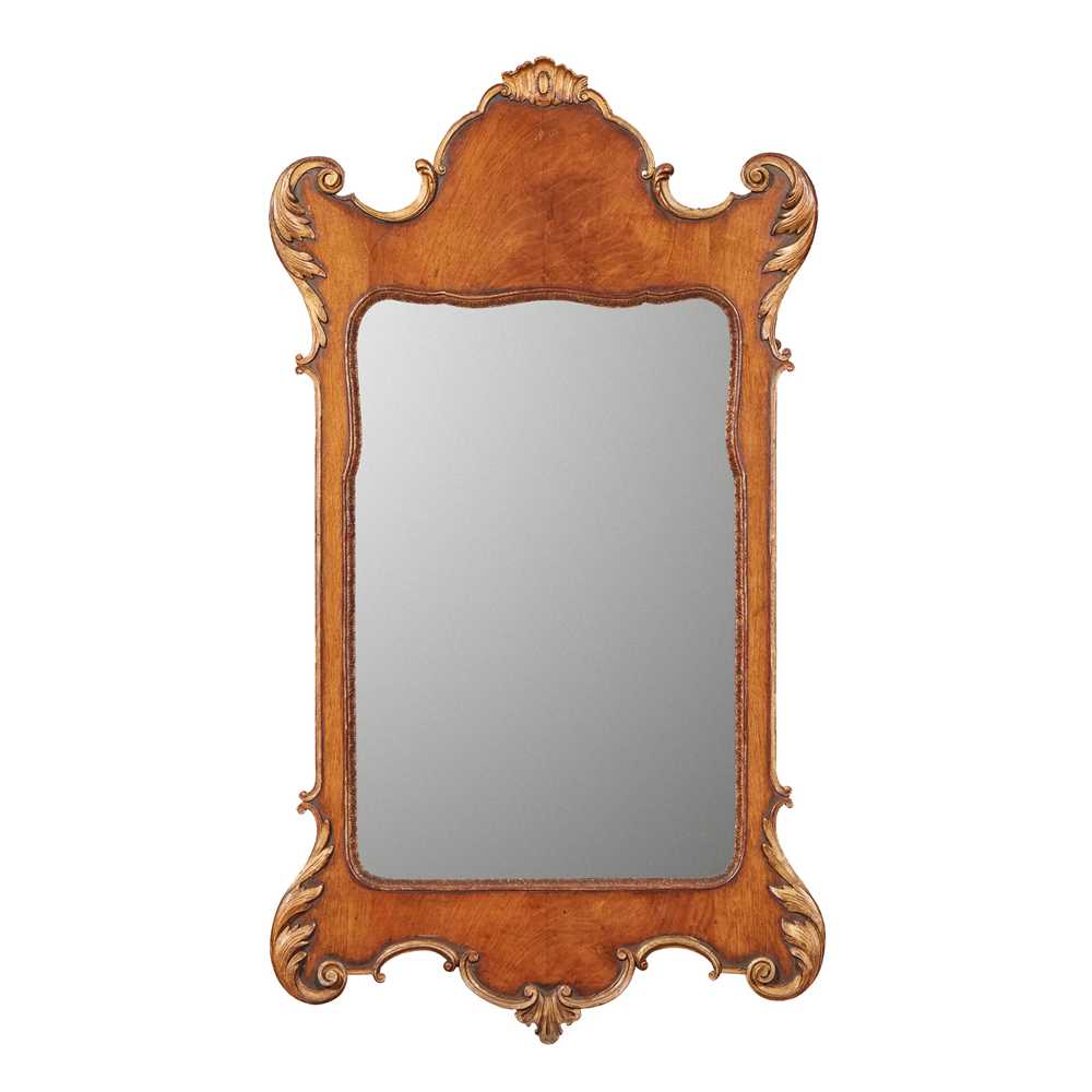 Appraisal: GEORGIAN STYLE MAHOGANY PARCEL-GILT MIRROR LATE TH CENTURY the shaped