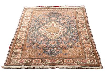 Appraisal: An Eastern rug with central floral medallion on a blue