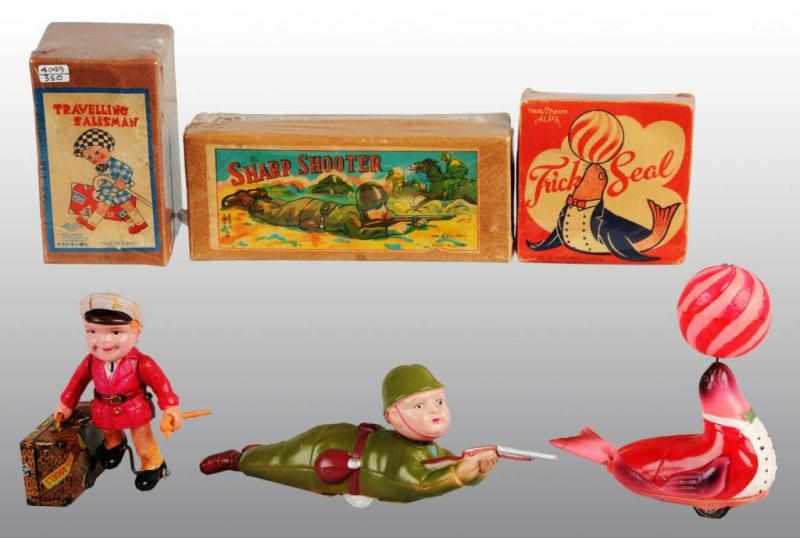 Appraisal: Lot of Tin Celluloid Wind-Up Toys Description Japanese Working Includes