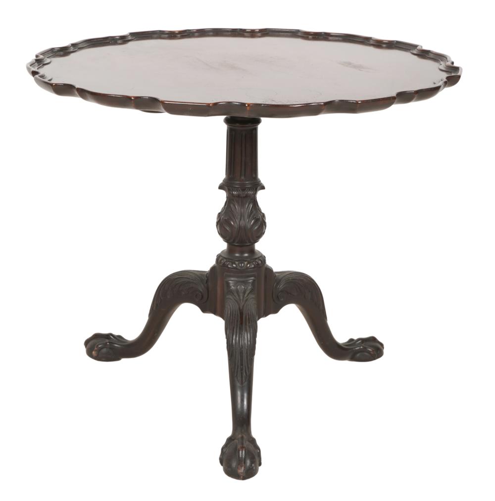 Appraisal: CHIPPENDALE-STYLE MAHOGANY TILT-TOP TABLEthe pie crust-rim top on a foliate