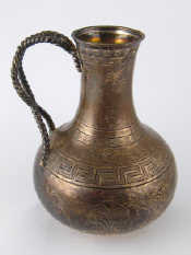 Appraisal: A Victorian silver jug with rope twist handle chased acanthus