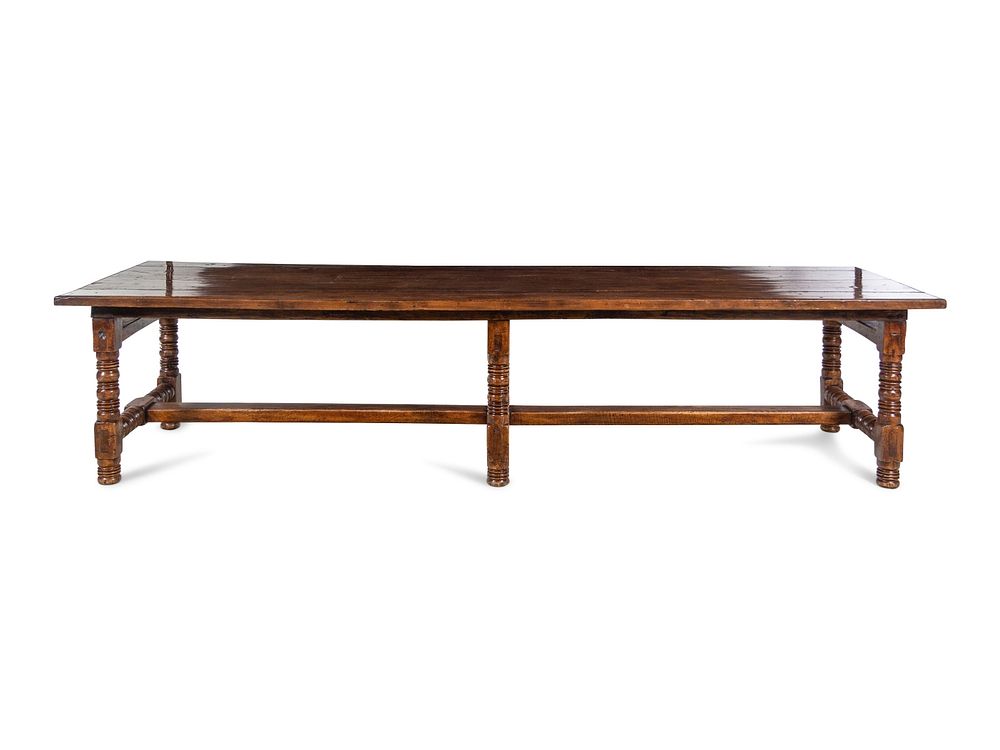 Appraisal: A Spanish or Portuguese Walnut Trestle Table A Spanish or