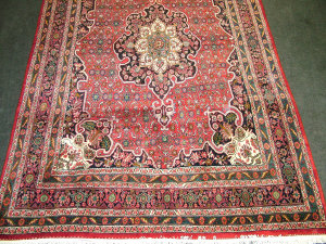 Appraisal: A Modern Kirman carpet with pole medallion spandrels and multiple