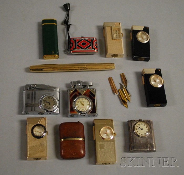 Appraisal: kt Gold Cartier Pen and a Large Group of Lighter