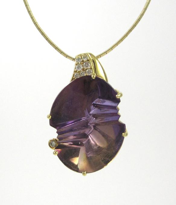 Appraisal: AMETHYST AND DIAMOND PENDANT NECKLACE suspended on a k yellow