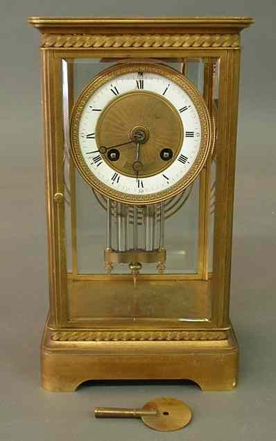 Appraisal: French brass carriage clock with beveled glass and a porcelain