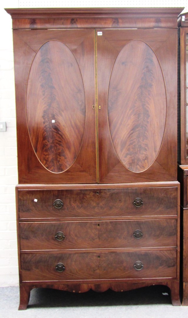 Appraisal: A George III boxwood strung mahogany linen press the pair