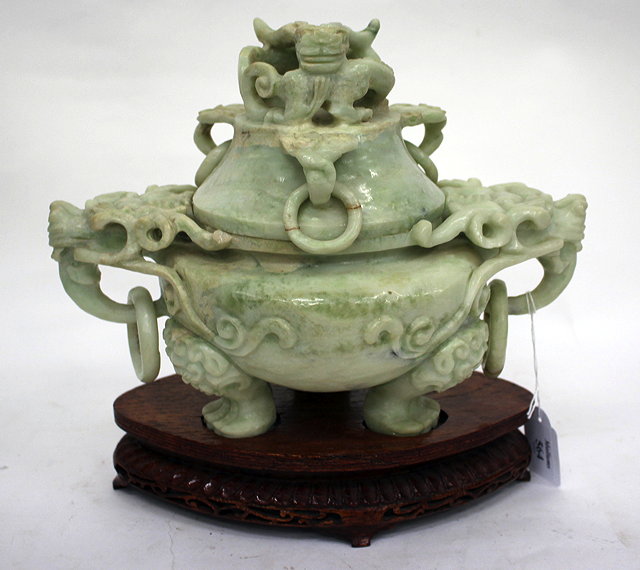 Appraisal: A PALE GREEN COLOURED HARDSTONE CARVED INCENSE BURNER decorated with