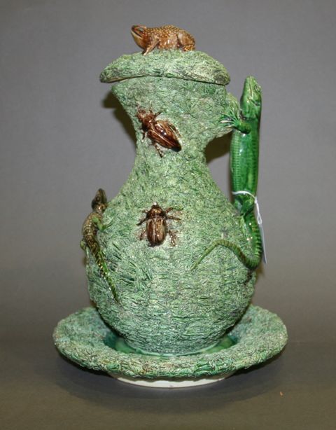 Appraisal: A Palissy style ewer with cover and stand by M