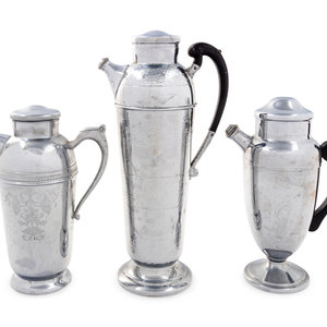 Appraisal: A Group of Three Cocktail Shakers th Century comprising one