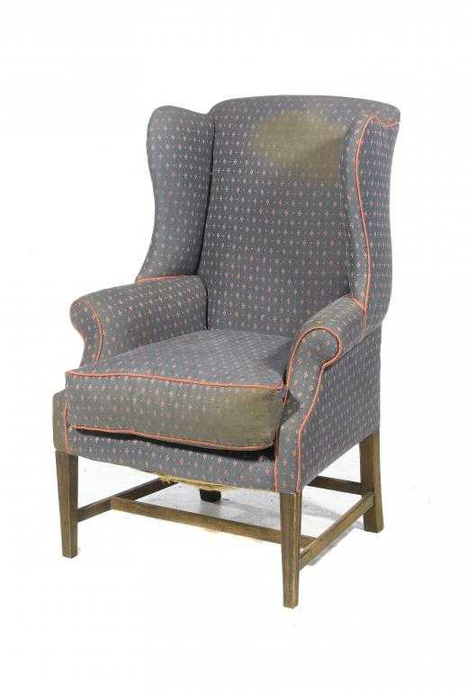 Appraisal: A MAHOGANY WING ARMCHAIR on moulded square tapered forelegs with