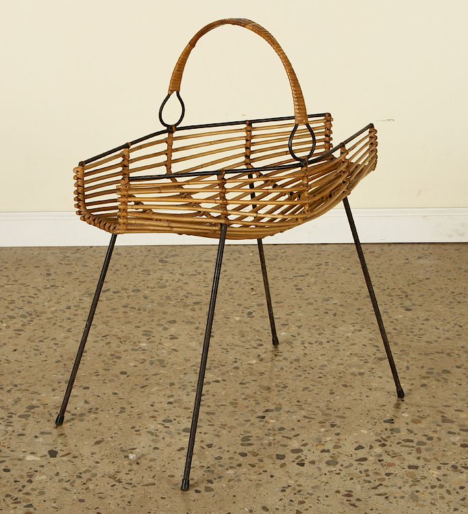 Appraisal: ITALIAN RATTAN AND IRON MAGAZINE STAND C A mid century