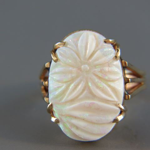 Appraisal: Opal Ring fiery oval gem with carved flower carats in