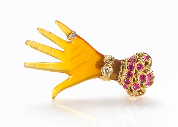 Appraisal: An amber diamond and ruby brooch Nardi in the form