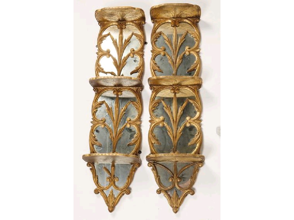 Appraisal: A PAIR OF VICTORIAN GILTWOOD WALL SHELVES each with three