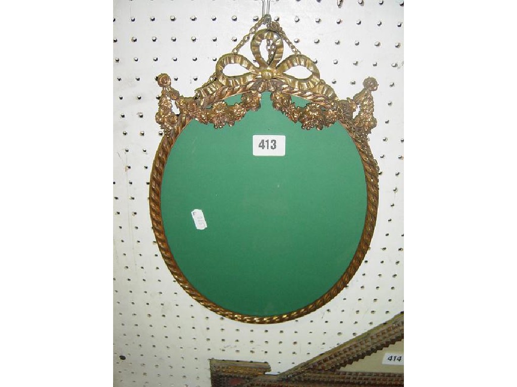 Appraisal: A hanging photograph frame of oval form in cast gilt