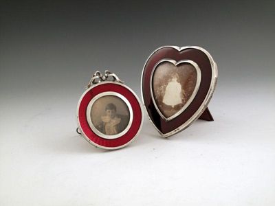 Appraisal: A late-Victorian silver and red enamel photograph frame by Henry