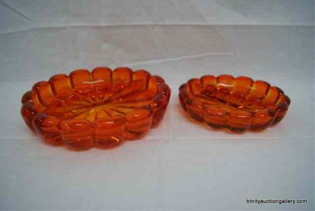 Appraisal: 's Orange Amberina Glass Ashtray SetThis is for a set