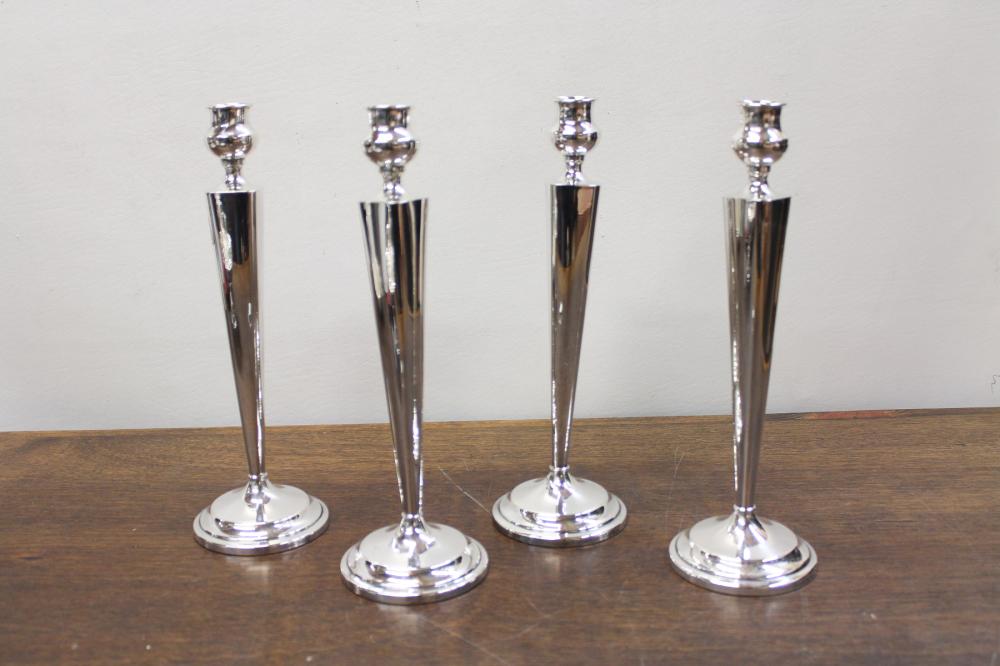 Appraisal: SET OF FOUR STERLING SILVER CANDLESTICKS with paneled columns marked