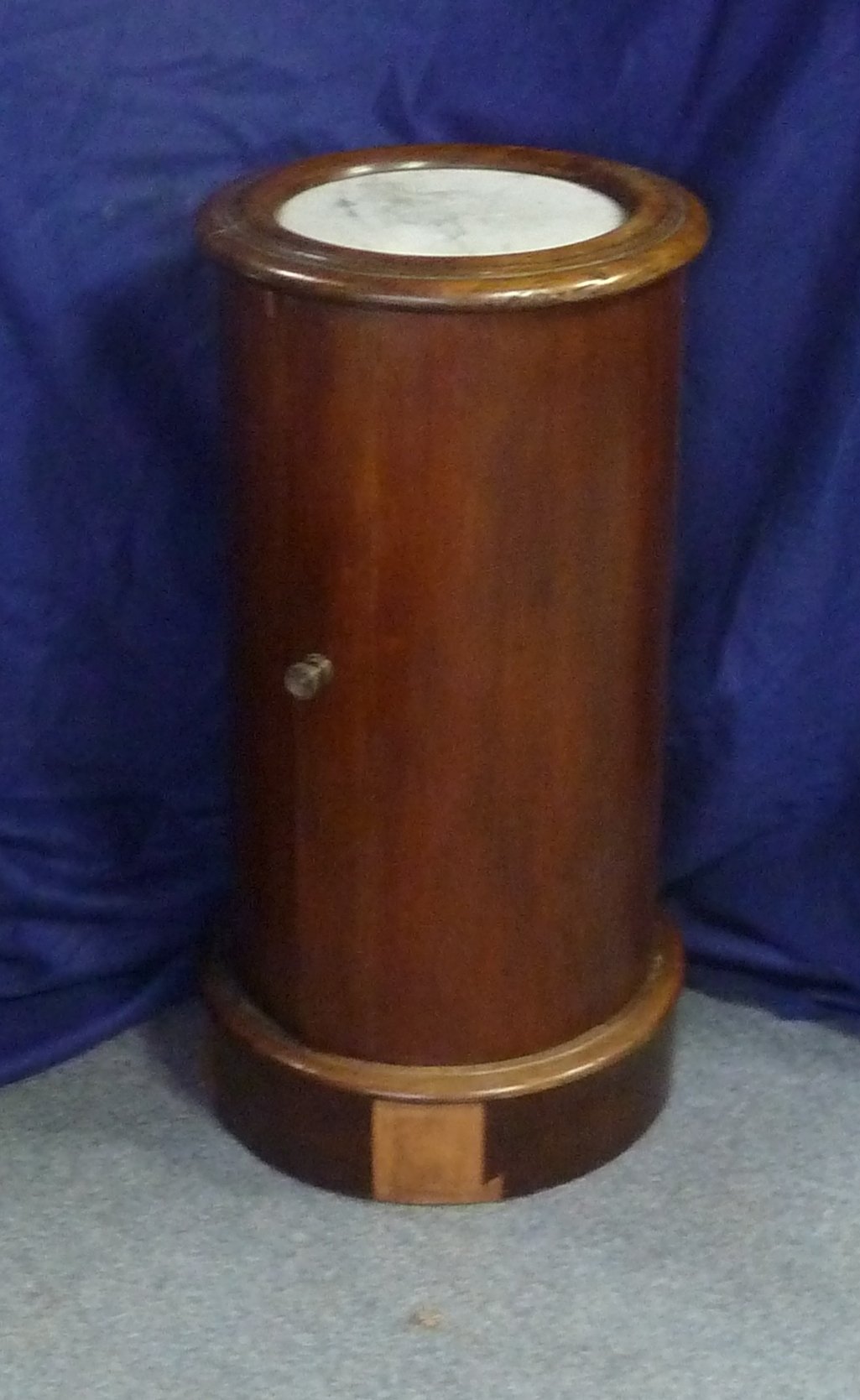 Appraisal: A Victorian mahogany bedside table of cylinder form with marble