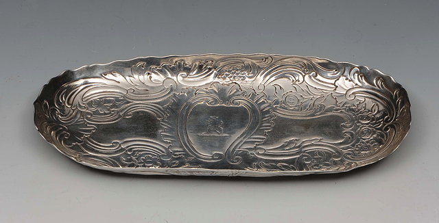 Appraisal: AN IRISH SILVER OVAL SHAPED SPOON TRAY chased with foliate